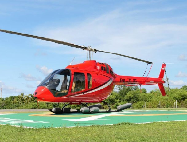 Bell 505 on a landing pad