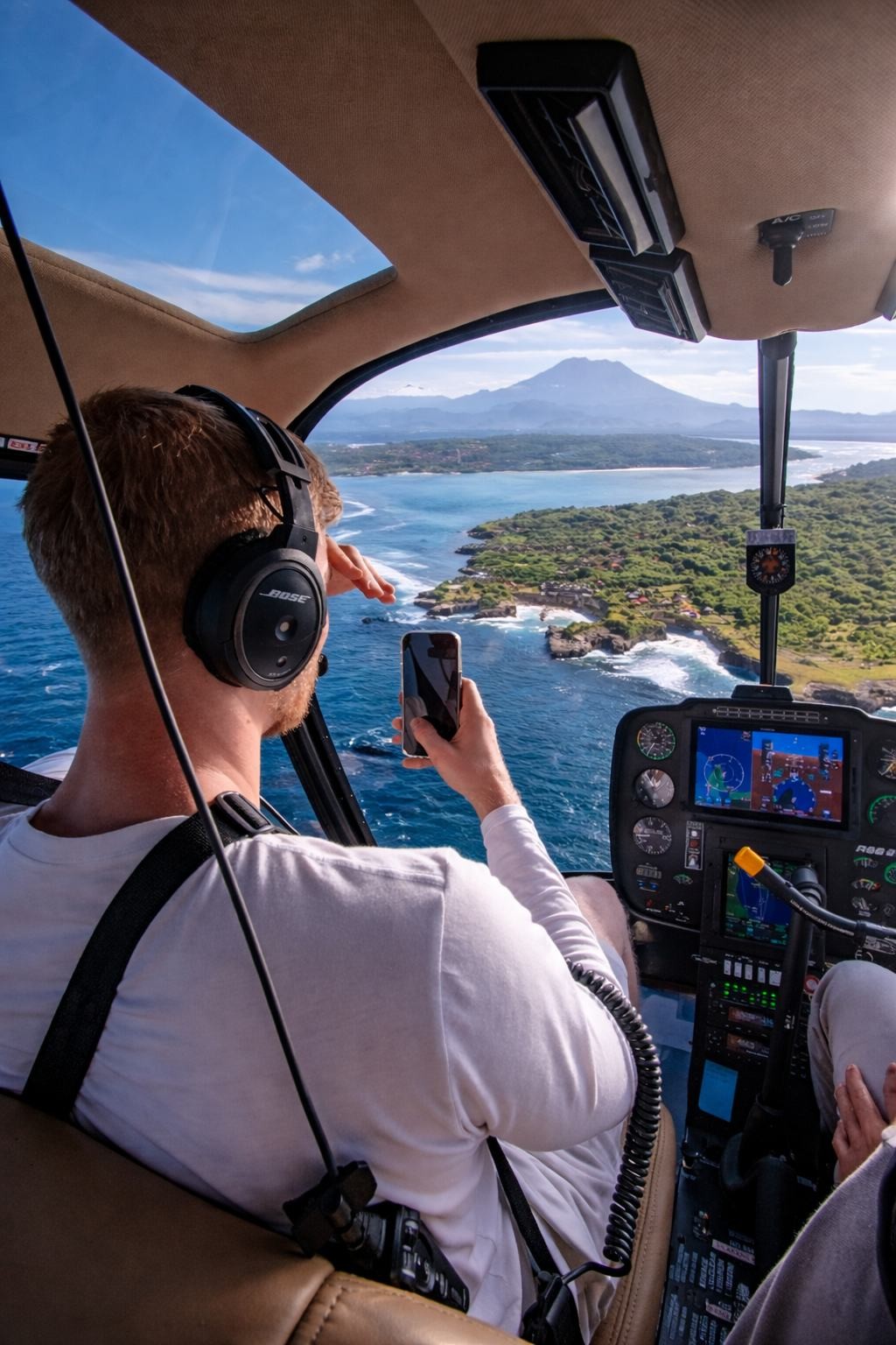 View of the Bali coastline from the helicopter cabin