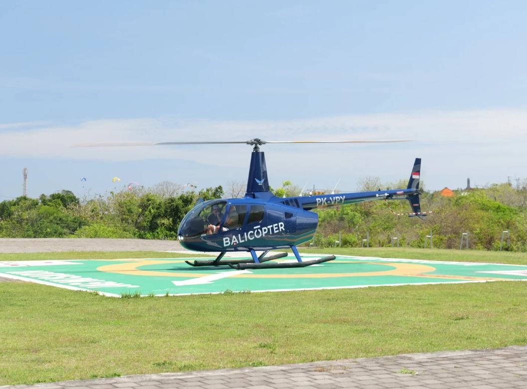 Robinson R66 at rest on a landing pad